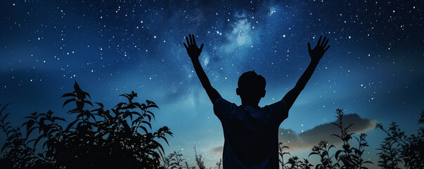Man Embracing Universe Under Starry Night Sky.
A solitary man with arms raised against a backdrop of the cosmos.