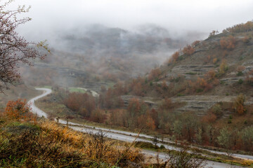 Sweet autumnal landscape with fall colors and low cloud cover, in the mountainous region of Grevena, in Macedonia region, Greece, Europe