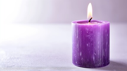 Close-up of a burning purple candle with a tranquil flame