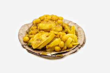 Alu Chat or Aloo Chaat Ghugni Garnished with Onion Cuts, Black Salt, Coriander in Disposable Bowl Isolated on White Background