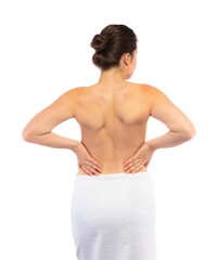 Young woman massaging back pain on white background
