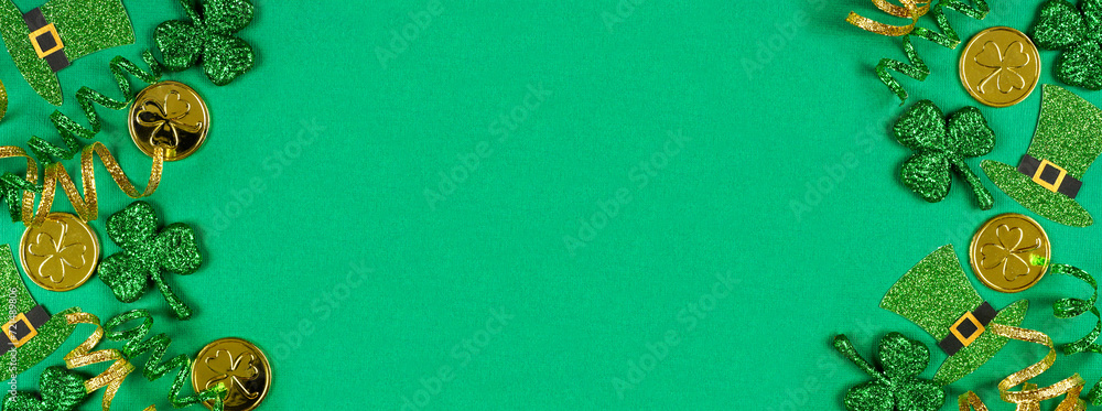 Poster st patricks day double border of shamrocks, leprechaun hats, gold coins and ribbon. top down view ov