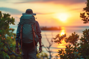 Solitary Backpacker Enjoying Sunset View by the Sea.