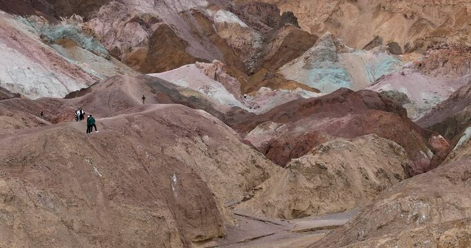 Death Valley Artists Palette colorful mountain tourist hiking. Largest national park in contiguous USA. 282 feet below sea level. Mojave Desert bordering Great Basin Desert. Ecological geology. 