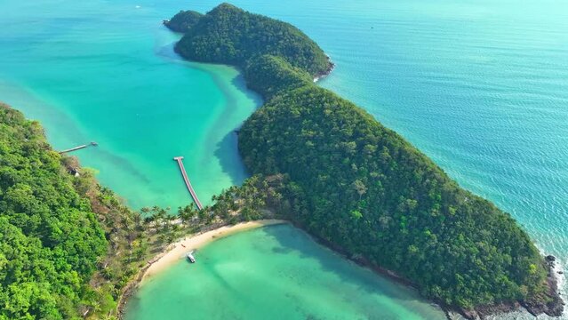 Aerial view of a mesmerizing tropical paradise. Turquoise waters, sandy shores, coconut trees, and lush green coastline. Adventure tourism concept. Ko Ngam, Mu Ko Chang National Park, Thailand. 4K.

