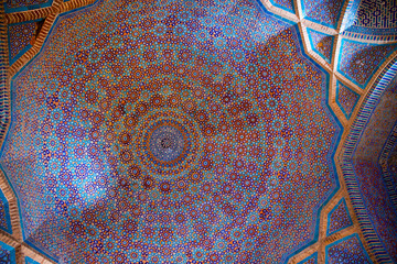 Magnificent traditional ceiling, kaleidoscope of golden, blue and orange colors in Shah Jahan Mosque in Thatta, Pakistan. Also known as Jamia Masjid of Thatta. 