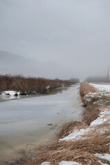 Looking down a ditch along Rannie Road near the Grant Narrows Regional Park and Pitt River Dike...
