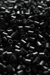 Obraz premium A close-up view of a pile of black beads. Perfect for jewelry making or crafting projects