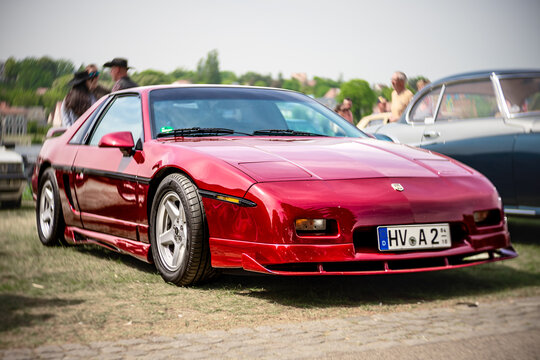WERDER (HAVEL), GERMANY - MAY 20, 2023: The sports car Pontiac Fiero SE, 1987. Swirl bokeh. Art lens. Oldtimer - Festival Werder Classics 2023
