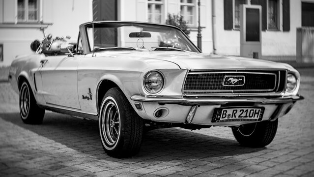 WERDER (HAVEL), GERMANY - MAY 20, 2023: The muscle car Ford Mustang Convertible. Swirl bokeh, art lens. Black and white. Oldtimer - Festival Werder Classics 2023