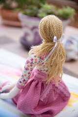 toddler doll on the colorful background, vintage style, selective focus
