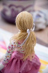 toddler doll on the colorful background, vintage style, selective focus