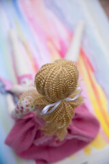 toddler doll on the colorful background, vintage style, selective focus