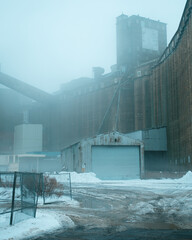 Abandoned industrial buildings at Silo City on a foggy winter day, Buffalo, New York