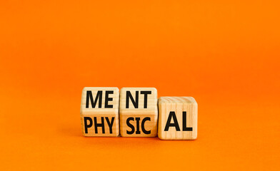 Mental or physical symbol. Concept word Mental or Physical on wooden cubes. Beautiful orange table orange background. Business lifestyle and mental or physical concept. Copy space.