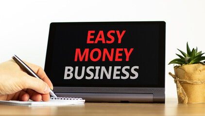 Easy money business symbol. Concept words Easy money business on beautiful tablet screen. Beautiful...