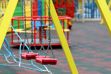 Children's playground in an urban environment. Conflicts between children on walks, problems of socialization. Children's games outdoors in an organized and safe space.