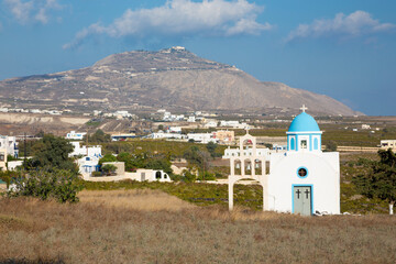 Santorini - The little chapel over Akrotiri and Mount Profitis Ilias in the backgroud.