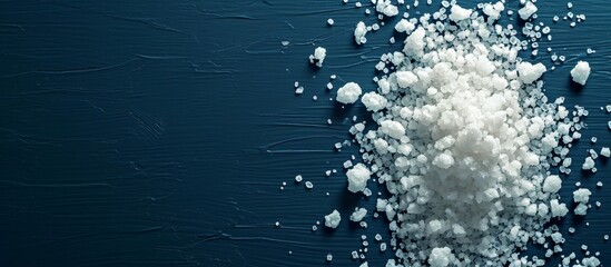 Salt Concept on Dark Blue Background: Enhancing the Salty Experience with a Captivating Concept on a Moody Dark Blue Background