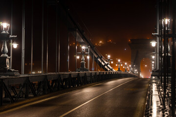 Fototapeta na wymiar Budapest, Hungary - January 18, 2024: Chain bridge at foggy night.