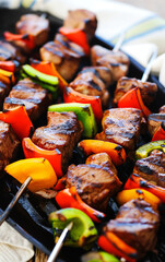 professional, up-close and modern food photography of grilled steak tip kabobs