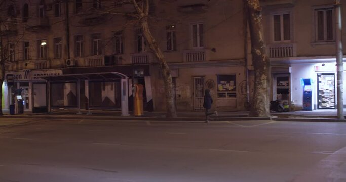 Girl running in the empty streets