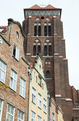 Fototapeta na wymiar St.Mary's Church And Gdansk Old Town Houses