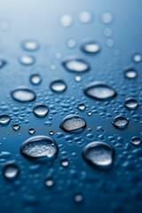 Close-up of water droplets on a blue surface