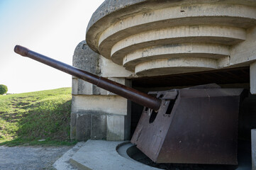 German bunker of Longues-sur-Mer battery (Batterie de Longues-sur-Mer) with a rusty cannon pointing