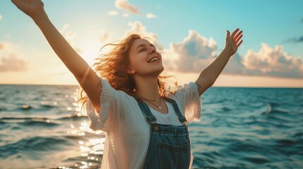 Fototapeta na wymiar happy young woman enjoying freedom with open hands on sea