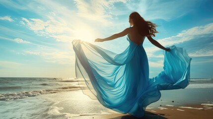Woman in Blue Dress Flying on Wind looking at Sky and Sea. Beautiful Model Arms outstretched enjoying Freedom
