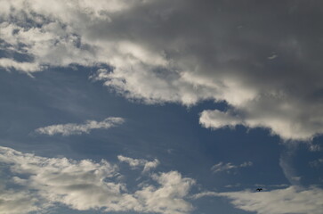 Background of rainy fluffy clouds floating on a bright blue sky, Sofia, Bulgaria  