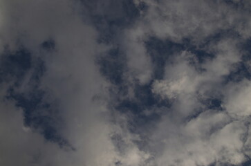 Obraz premium Background of rainy fluffy clouds floating on a bright blue sky, Sofia, Bulgaria 