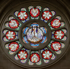 BERN, SWITZERLAND - JUNY 27, 2022: The Pelican as symbolo of offer of Jesus on the stained glass...