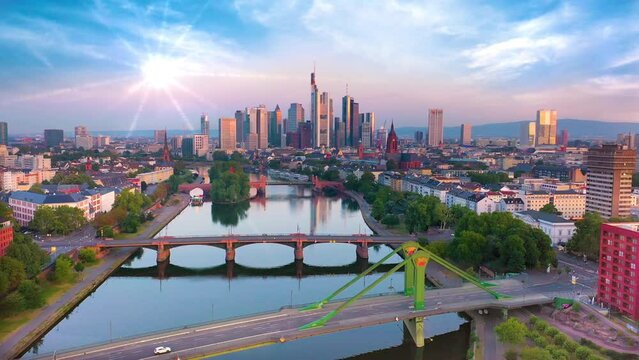 Frankfurt aerial skyline view fly over city downtown in fornt frankufrt am main germany skyscrapers and on left frankfurt old town fly over bridge and river frankfurt panorama.