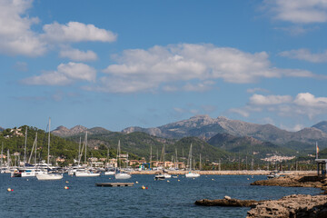 boats moored at Port D'Andratx marina with mountains in a background