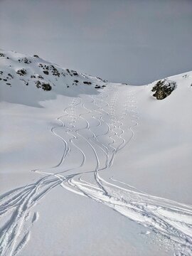 Beautiful deep snow trail left by skiers. Departure from Schwarzst&ouml;ckli in Glarus. Fun in the deep snow. Ski tour in the Swiss Alps. High quality photo