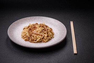 Delicious Asian cuisine dish with rice noodles, peppers, mushrooms and spices