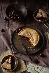 Cherry pie on dark brown background 
