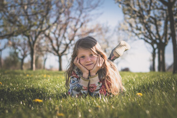 child in spring nature, relaxing and having good time