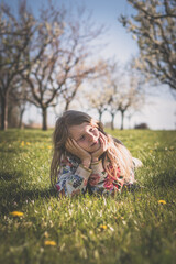 child in spring nature, relaxing and having good time - 721585880