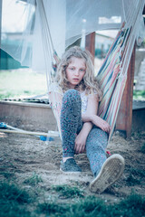 bored teenage girl in hammock swing - 721586236