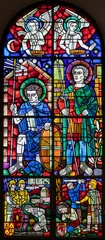  BERN, SWITZERLAND - JUNY 27, 2022: The St, Ursus of Solothurn and St. Victor on the stained glass in the church Dreifaltigkeitskirche by A. Schweri (1938). © Renáta Sedmáková