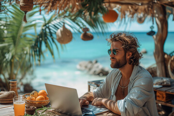 Man with laptop combines vacation with remote work, digital nomads