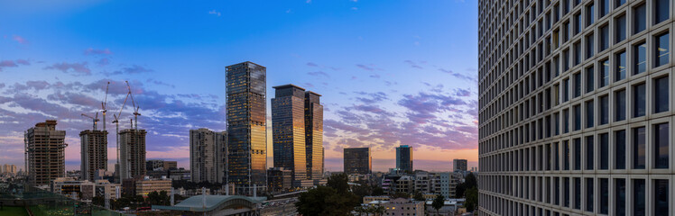 Israel, Tel Aviv financial business district skyline with shopping malls and high tech offices at sunset