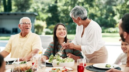 Food, thanksgiving and grandparents with family or child at table outdoor for celebration or tradition. Salad, sharing or lunch with people, grandma and kid eating meal together in a social gathering - Powered by Adobe