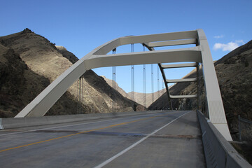 photograph of the time zone bridge over the salmon river separating mountain time and pacific time north of riggins idaho on us highway 95 north and south.