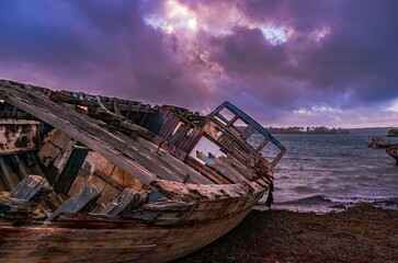old destroyed boat on the beach