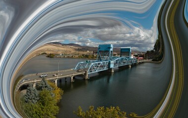 artistically framed drone photograph of the blue bridge connecting Lewiston Idaho and Clarkston...