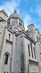 Fototapeta na wymiar PARIS, FRANCE - MARCH 12, 2023: Basilica of the Sacred Heart at Montmartre hill in Paris Basilica of Sacre Coeur in a summer day, France